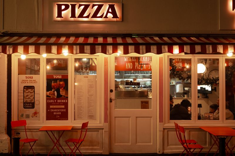 Pizza inn franchise team working together in a professional kitchen